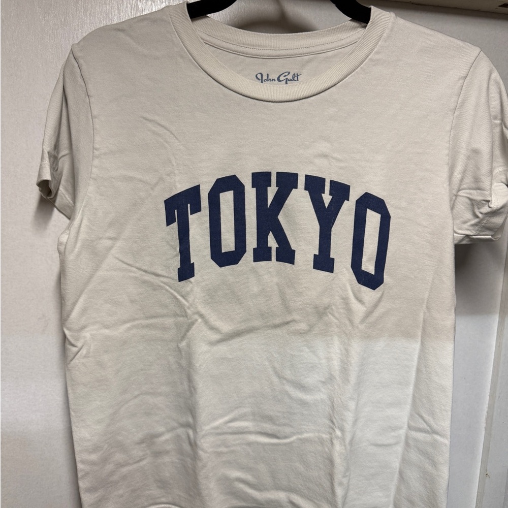 Woman’s Brandy Melville Beige Tee with Navy Tokyo Print